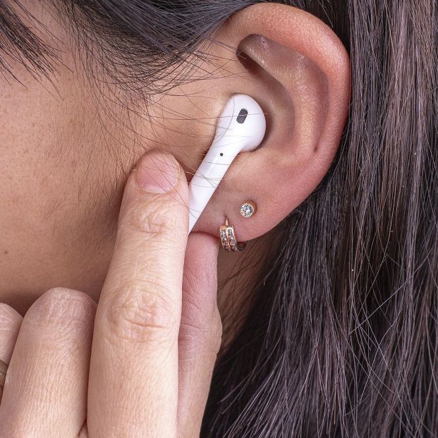 bigstock Mature Woman Wearing Earphones 332627833